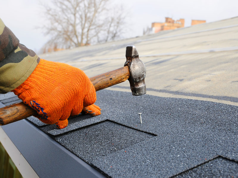 man installing roof tiles ashland va