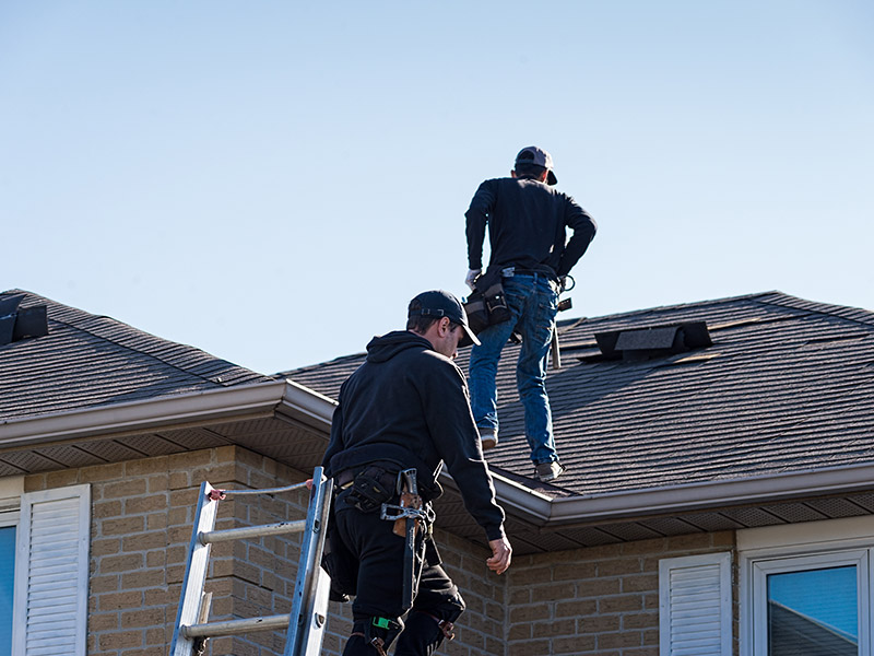 two certified roof inspectors walking on roof ashland va
