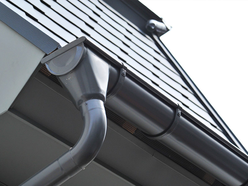 Lateral coated metal Panel coated Rain Gutter and Rain Water Pipe at a Roof covered with Metal Shales ashland va