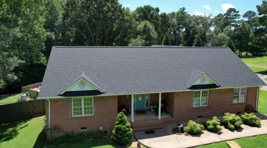 aerial view of a house with a shingle roof installed ashland va