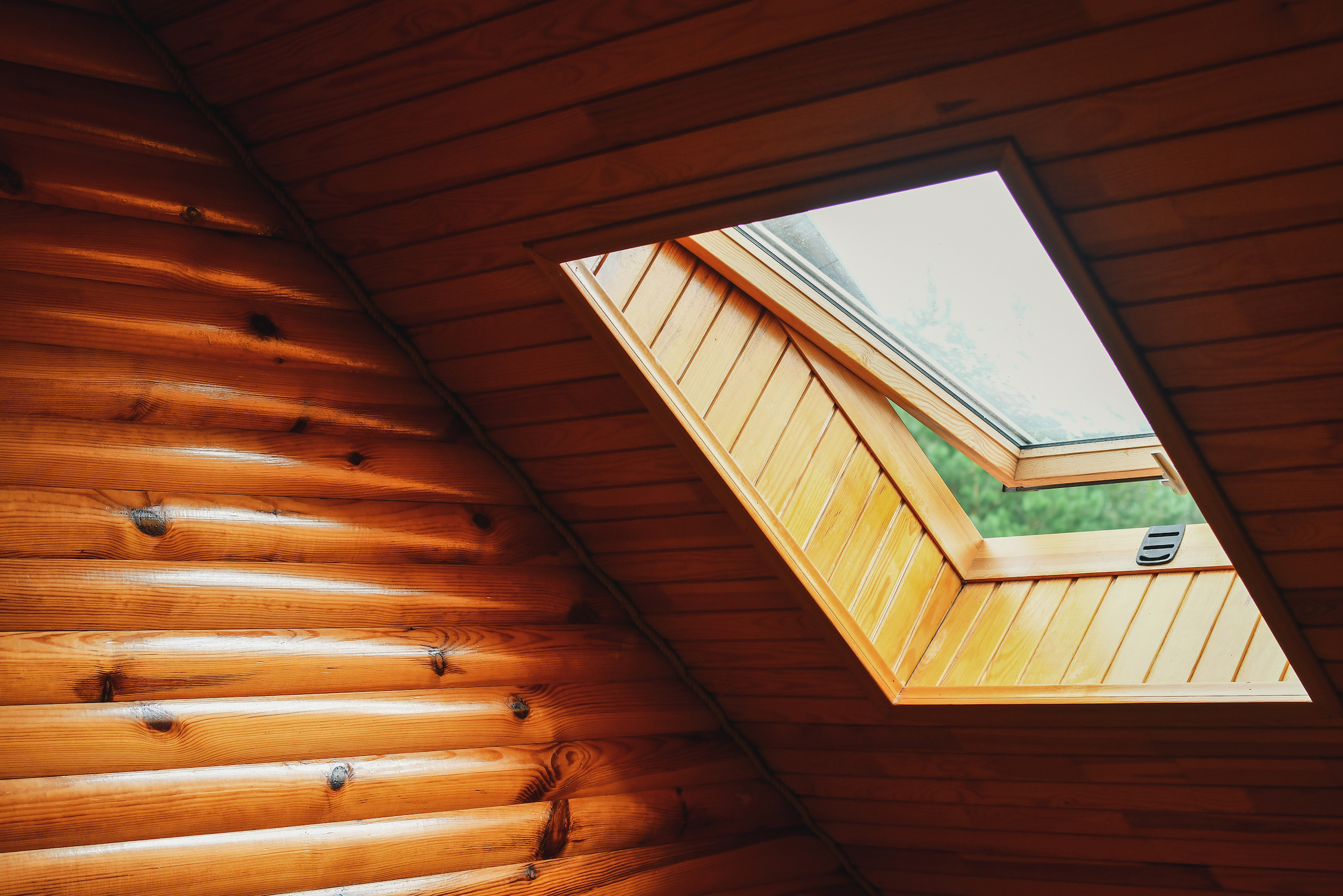 Wood paneled room with skylight